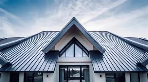 Standing seam metal roof installation on a Pensacola Beach home by Complete Roofing LLC